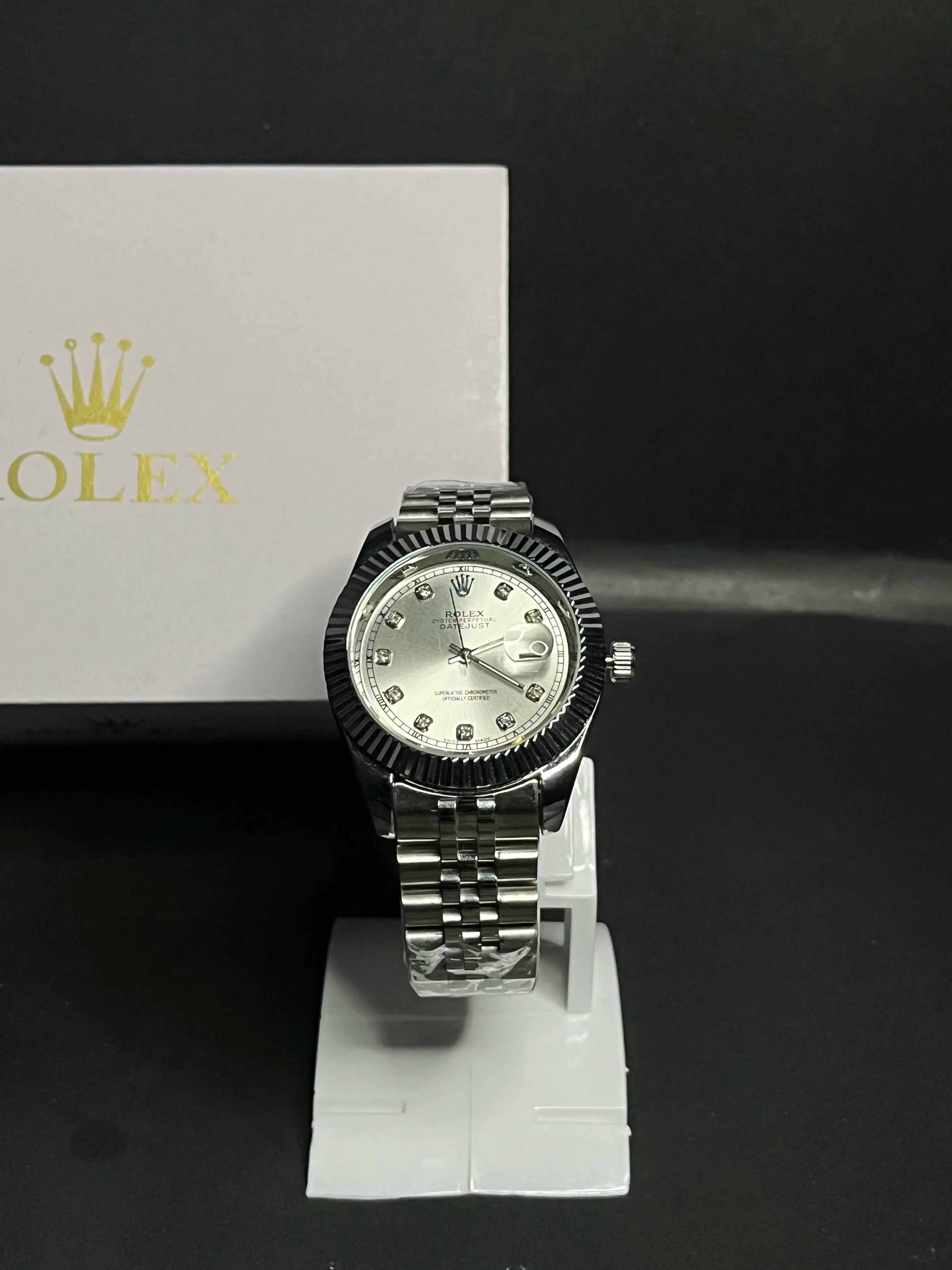 Rolex Datejust, Silver dial with diamond-set hour markers,a model with a silver dial, fluted bezel, and jubilee bracelet.