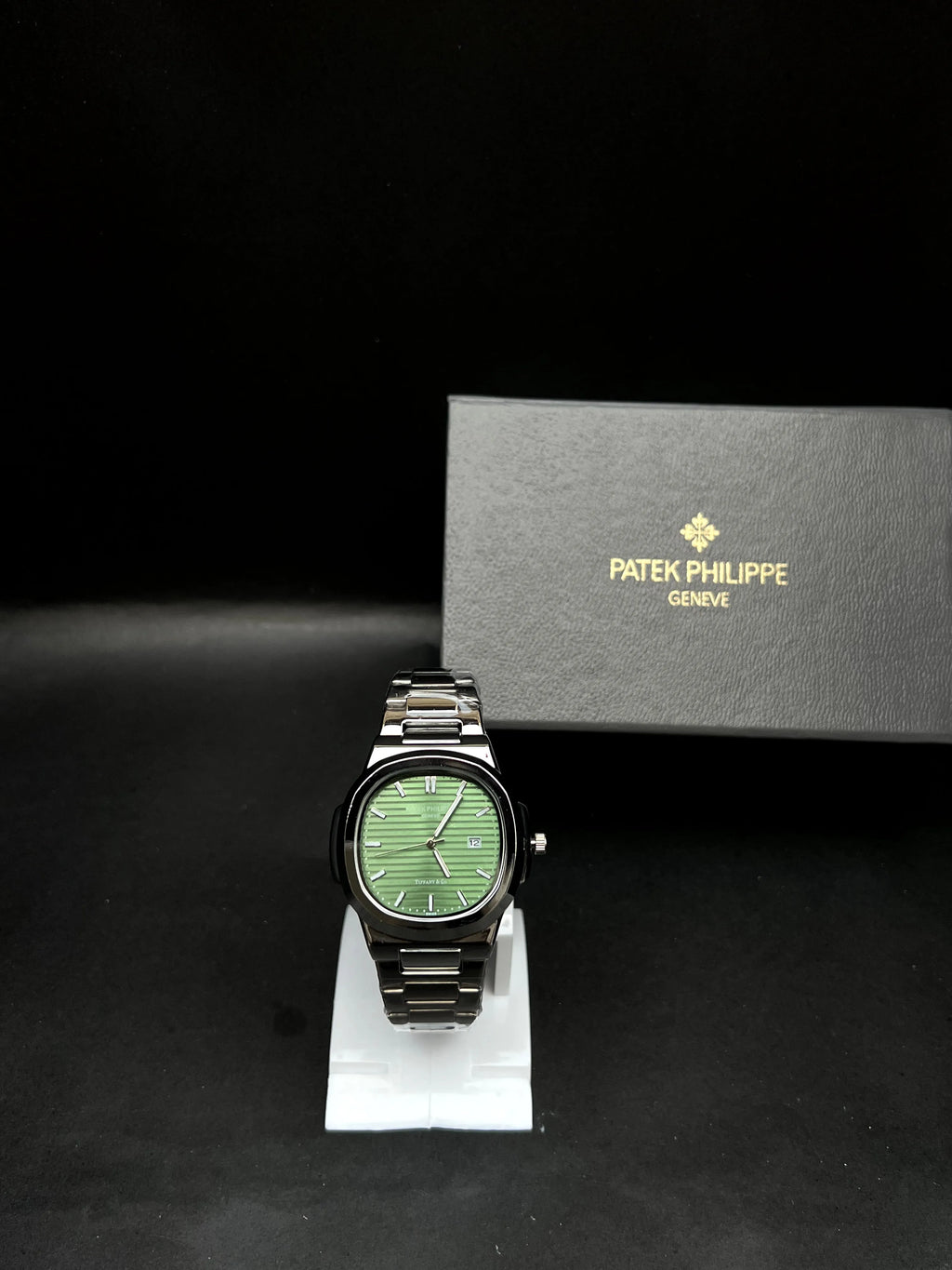 Patek Philippe Nautilus, rich green horizontally embossed dial, the date display at 3 o’clock