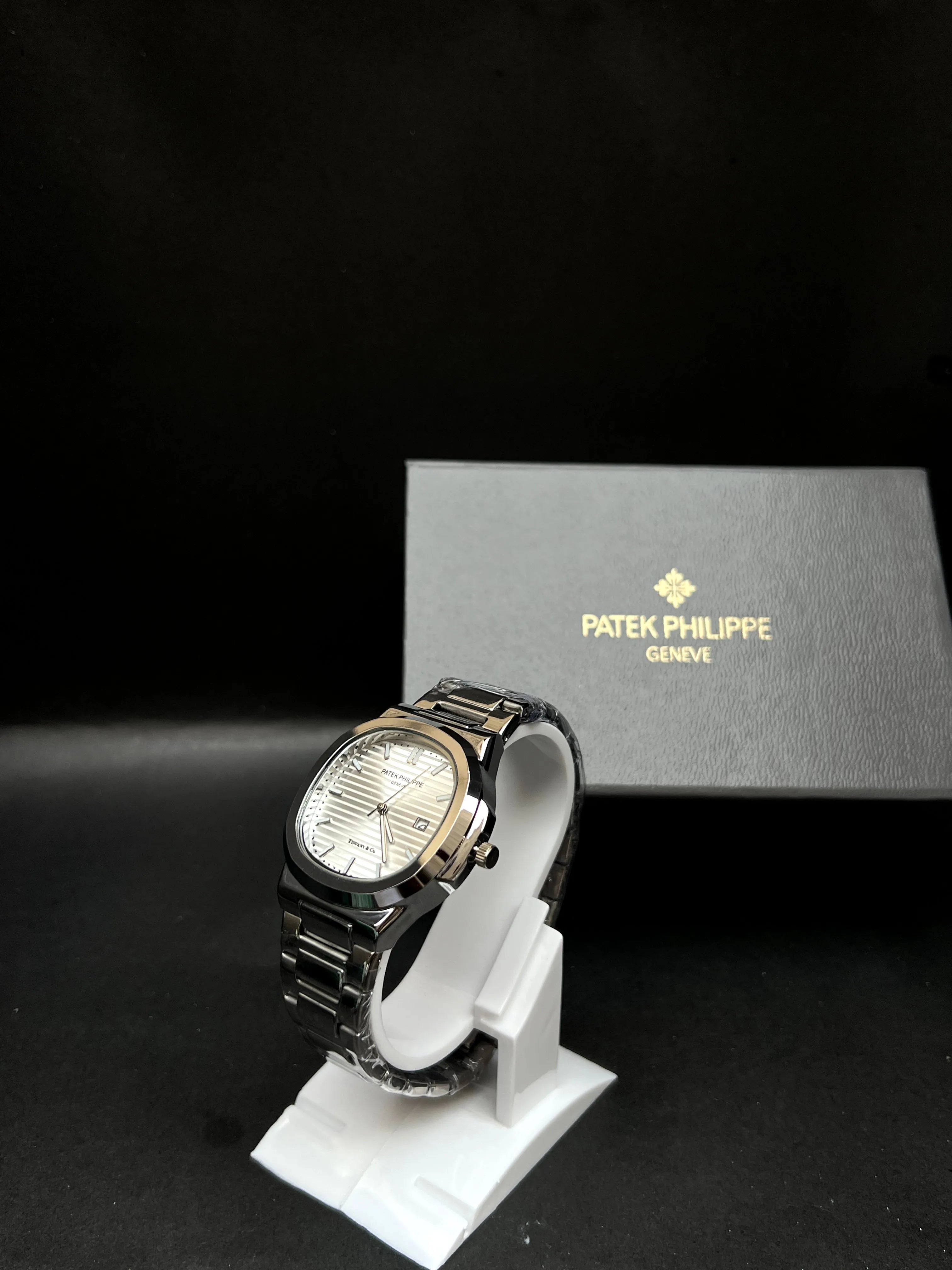Patek Philippe, Nautilus, datejust with silver horizontally embossed dial, Stainless steel.