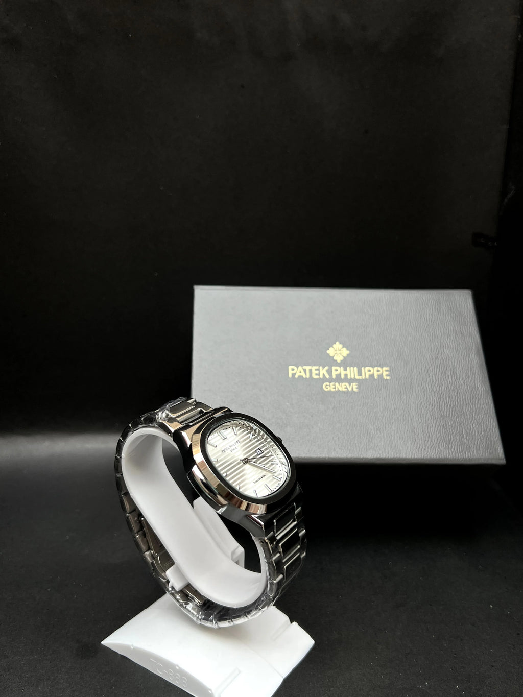 Patek Philippe, Nautilus, datejust with silver horizontally embossed dial, Stainless steel.