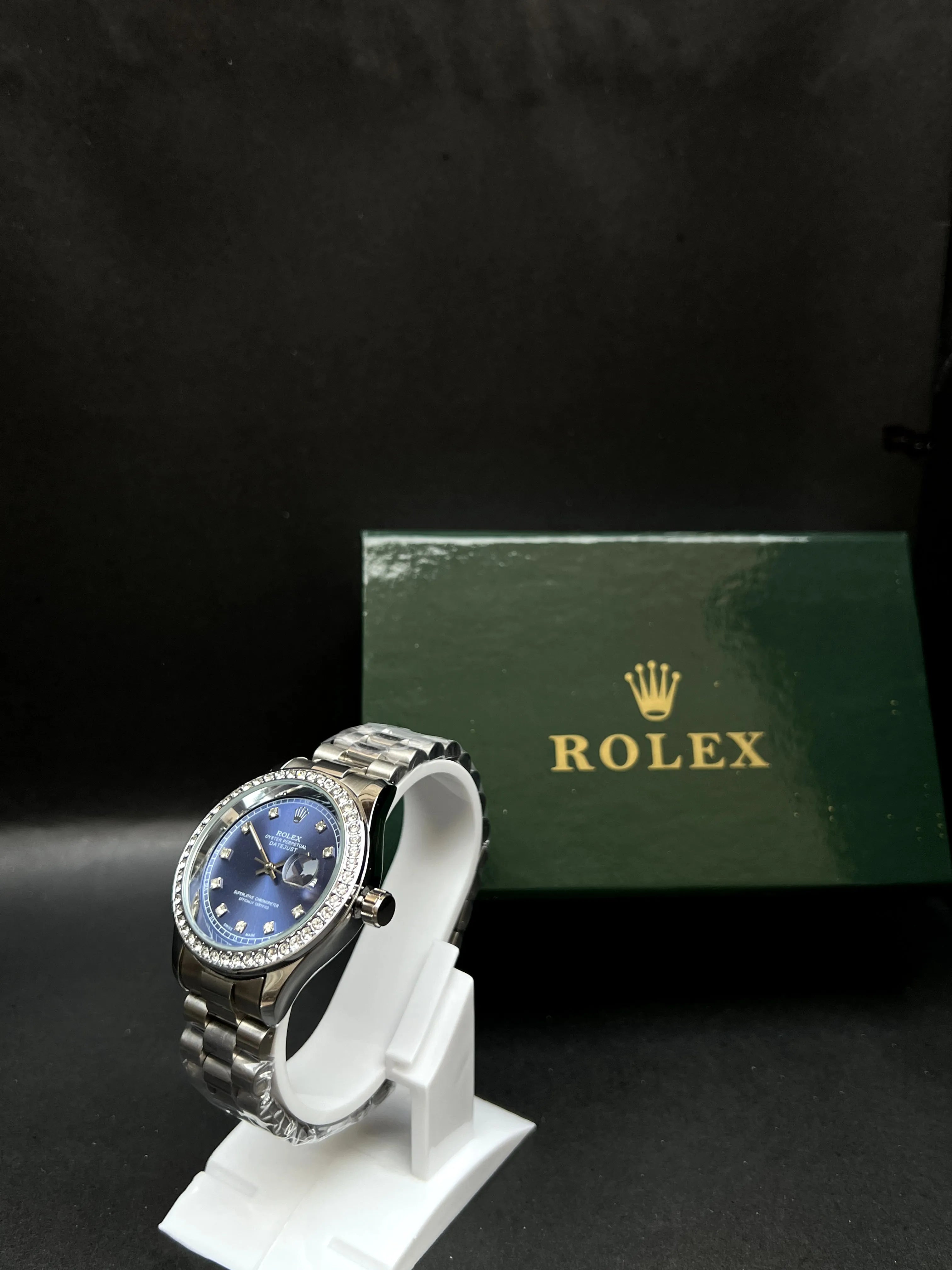 Rolex Oyster Perpetual Datejust with a stunning sunburst blue dial accented by diamond hour markers
