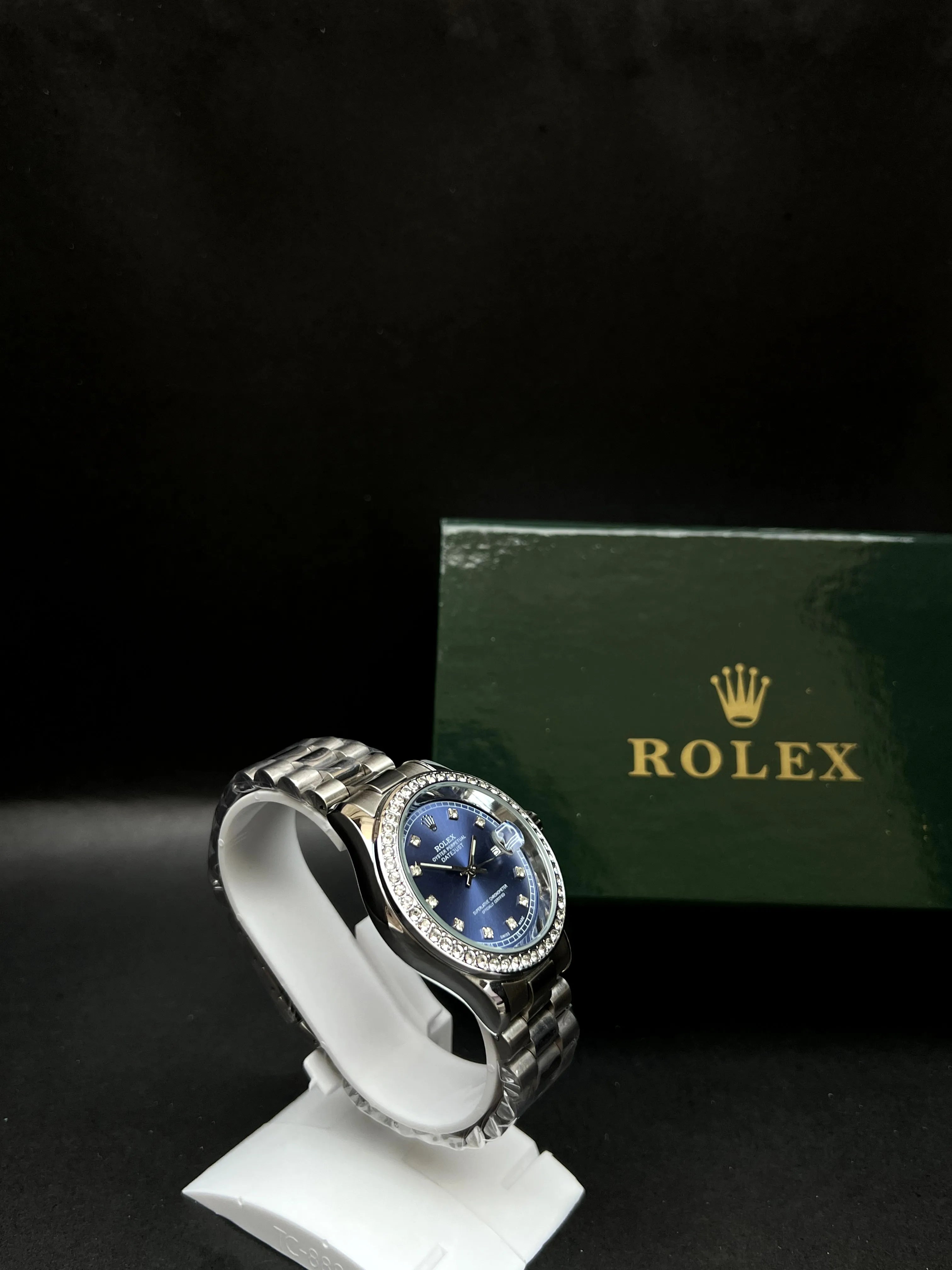 Rolex Oyster Perpetual Datejust with a stunning sunburst blue dial accented by diamond hour markers