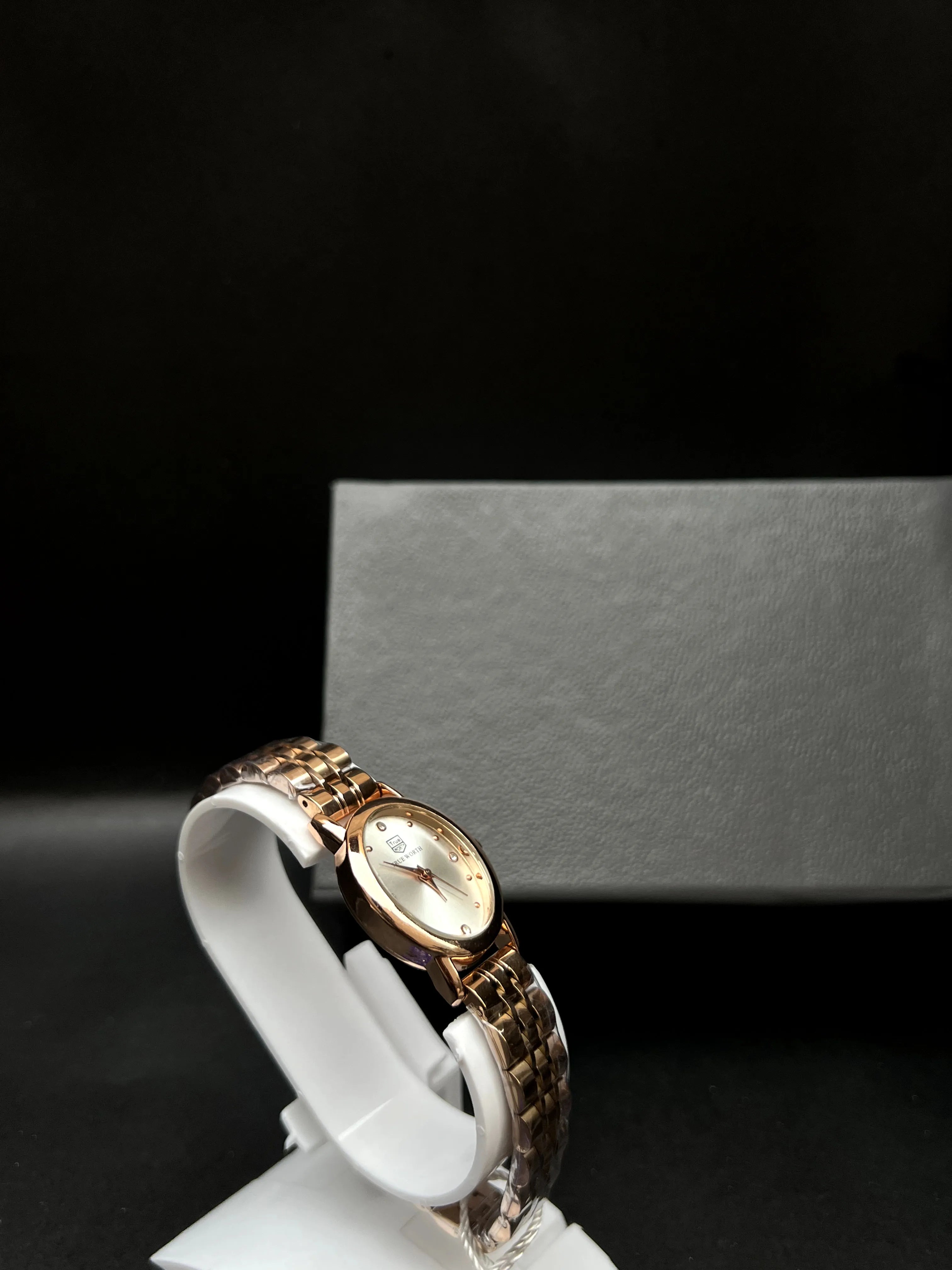 True Worth Rose Gold Rectangular Bracelet Watch with Champagne Dial