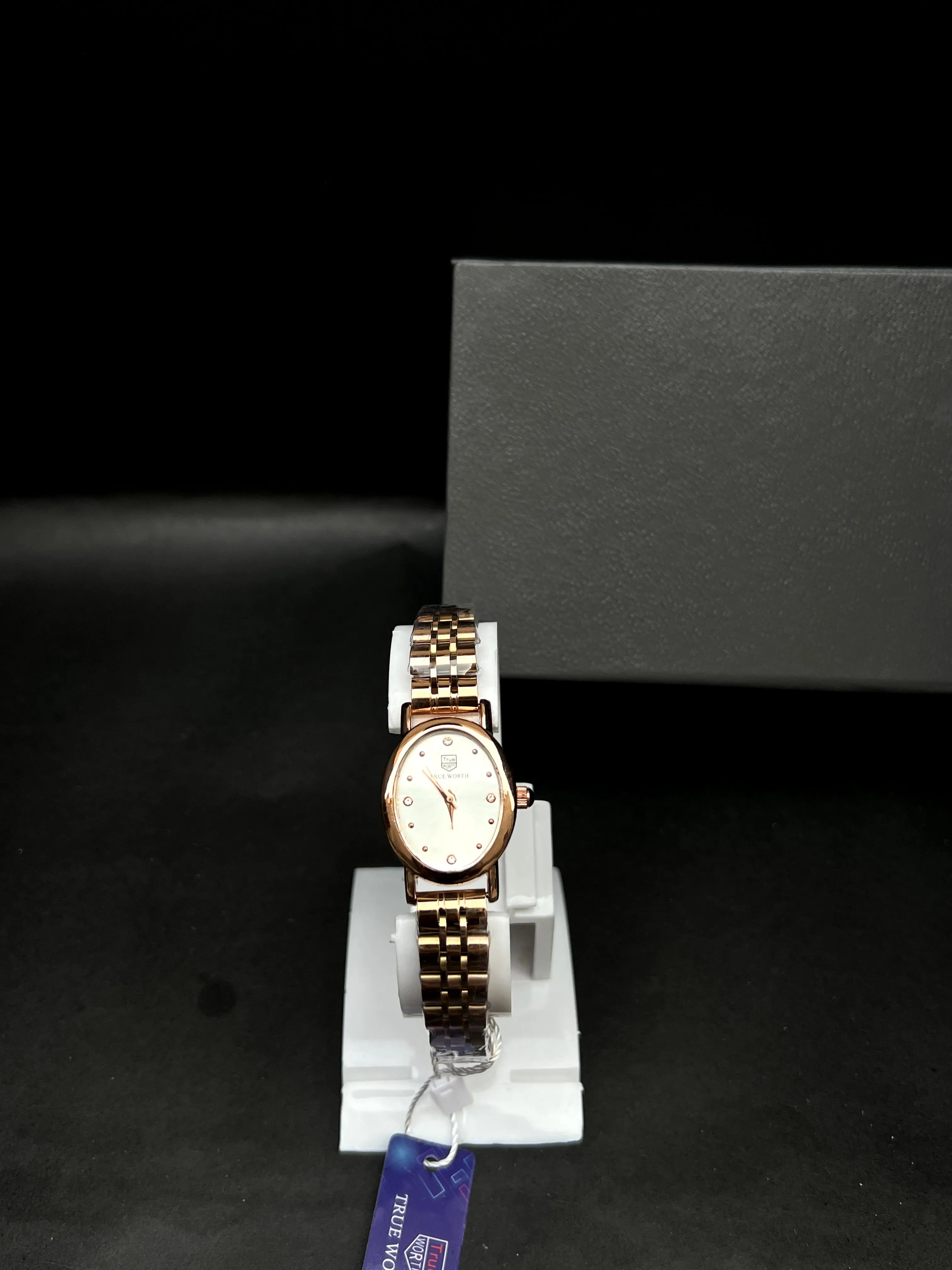 True Worth Rose Gold Rectangular Bracelet Watch with Champagne Dial