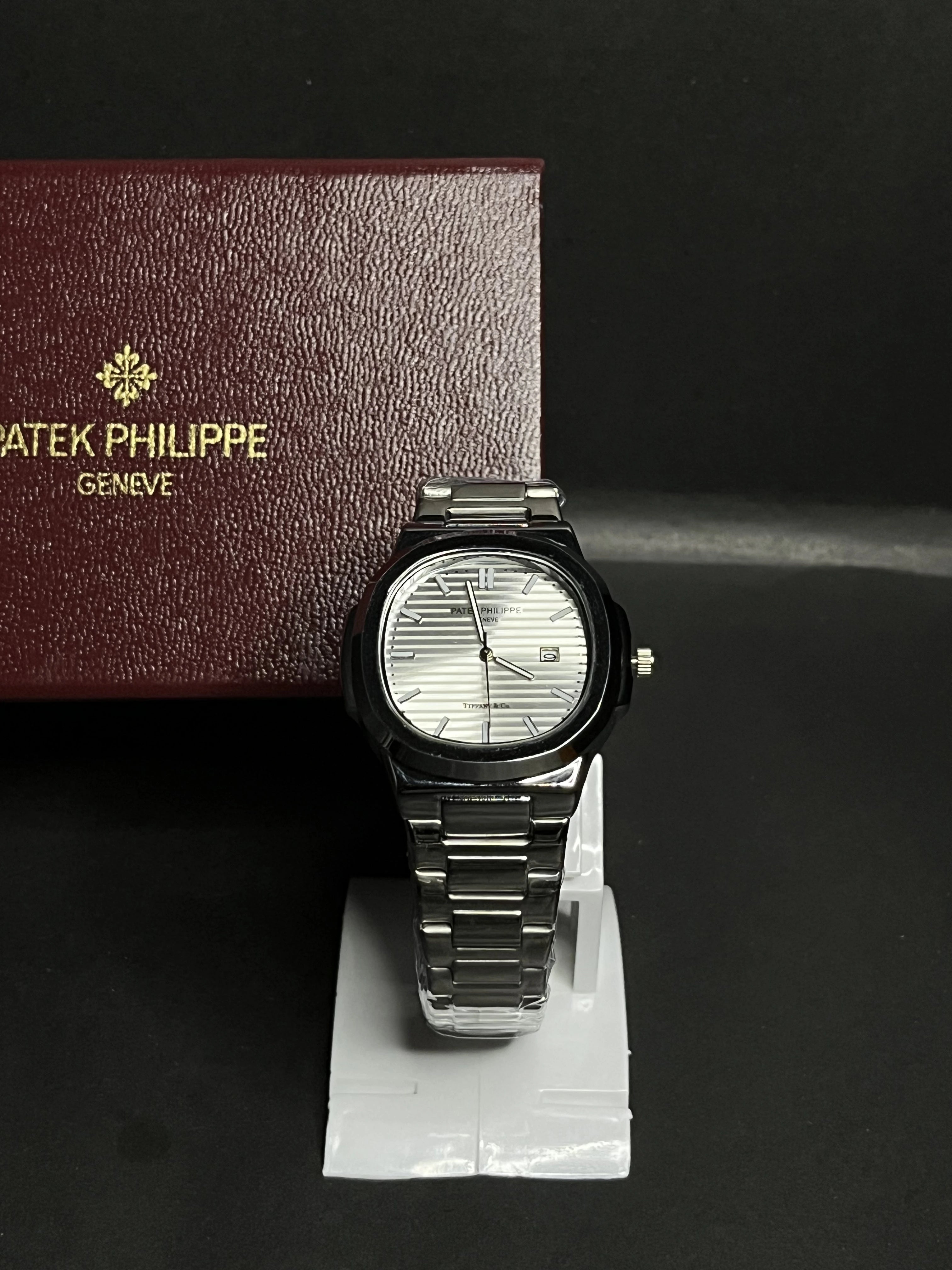 Patek Philippe, Nautilus, datejust with silver horizontally embossed dial, Stainless steel.