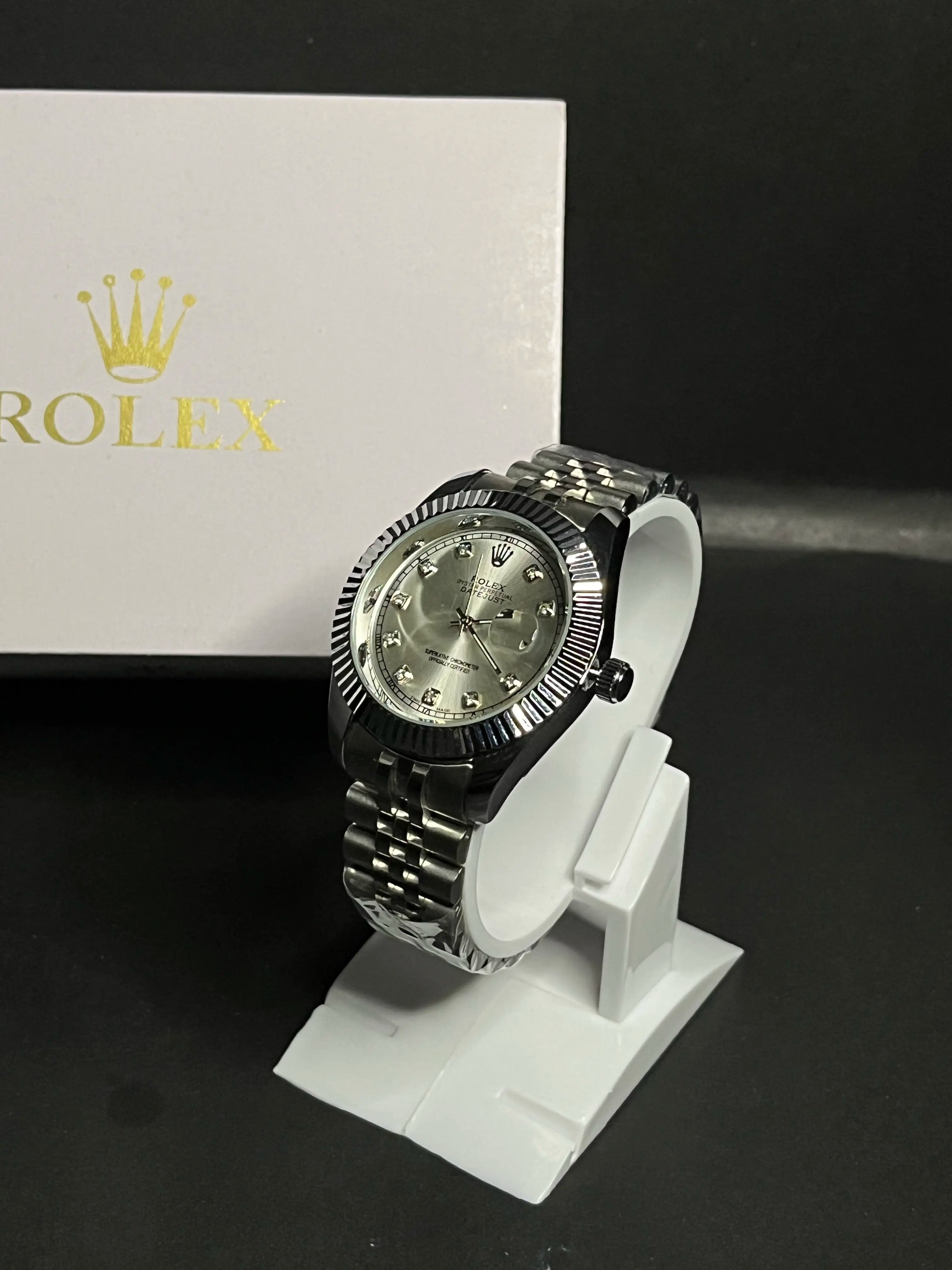 Rolex Datejust, Silver dial with diamond-set hour markers,a model with a silver dial, fluted bezel, and jubilee bracelet.