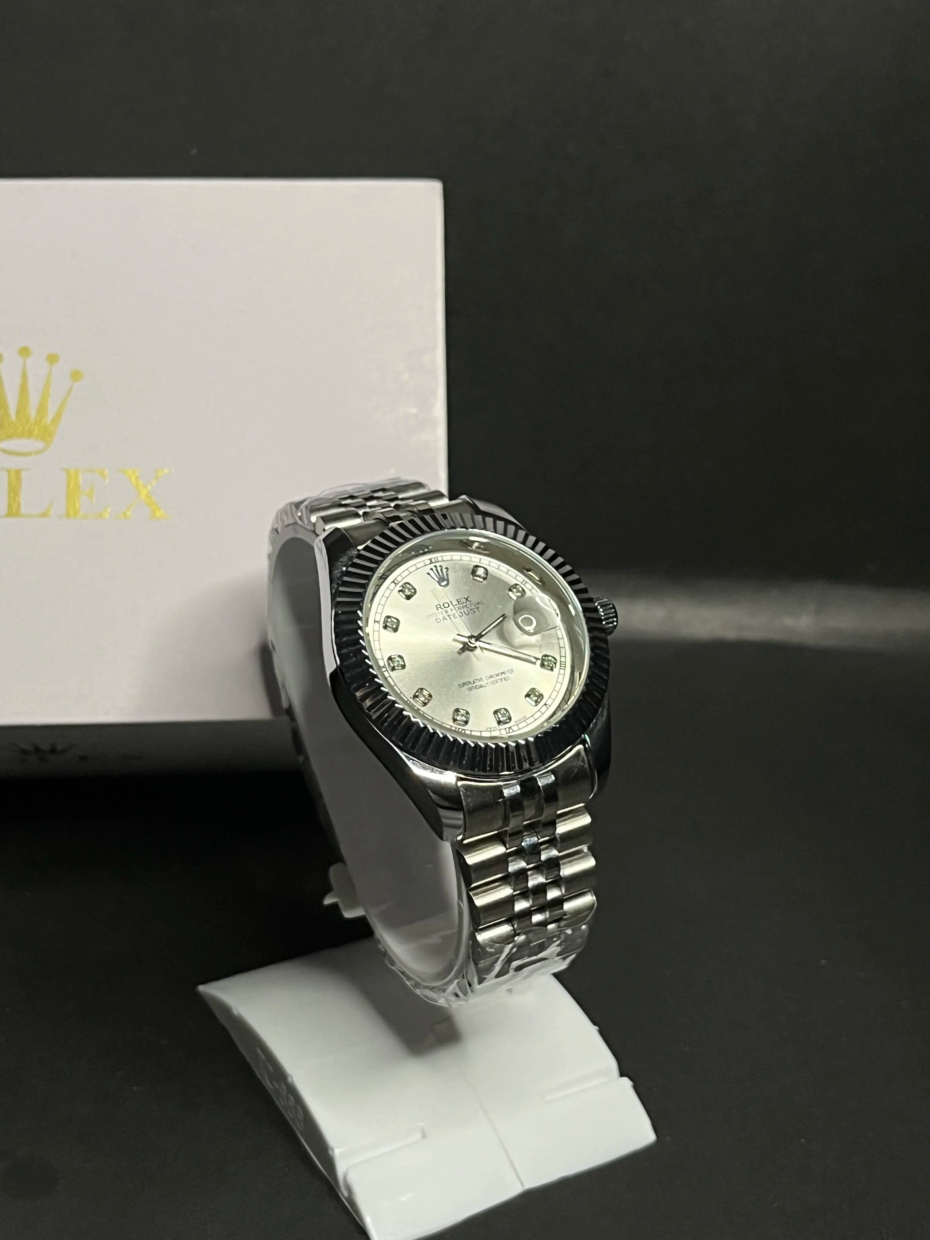 Rolex Datejust, Silver dial with diamond-set hour markers,a model with a silver dial, fluted bezel, and jubilee bracelet.