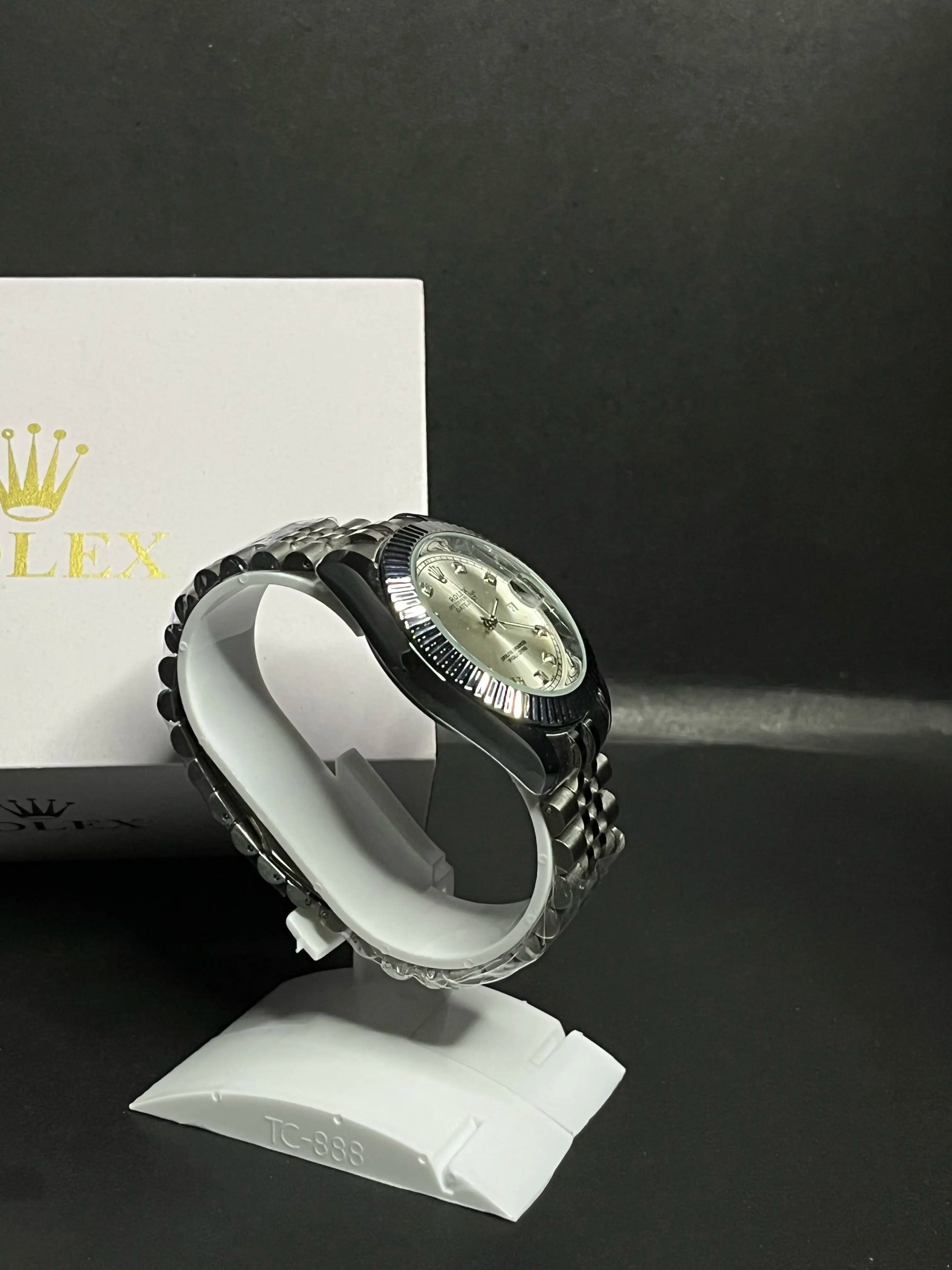 Rolex Datejust, Silver dial with diamond-set hour markers,a model with a silver dial, fluted bezel, and jubilee bracelet.