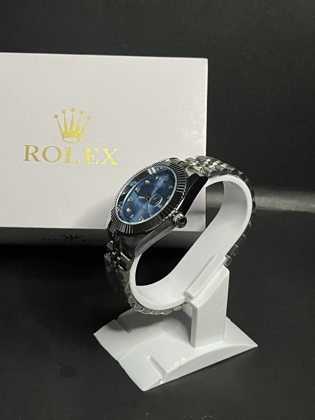 Rolex Oyster Perpetual Datejust featuring an elegant ice-blue dial adorned with diamond hour markers.