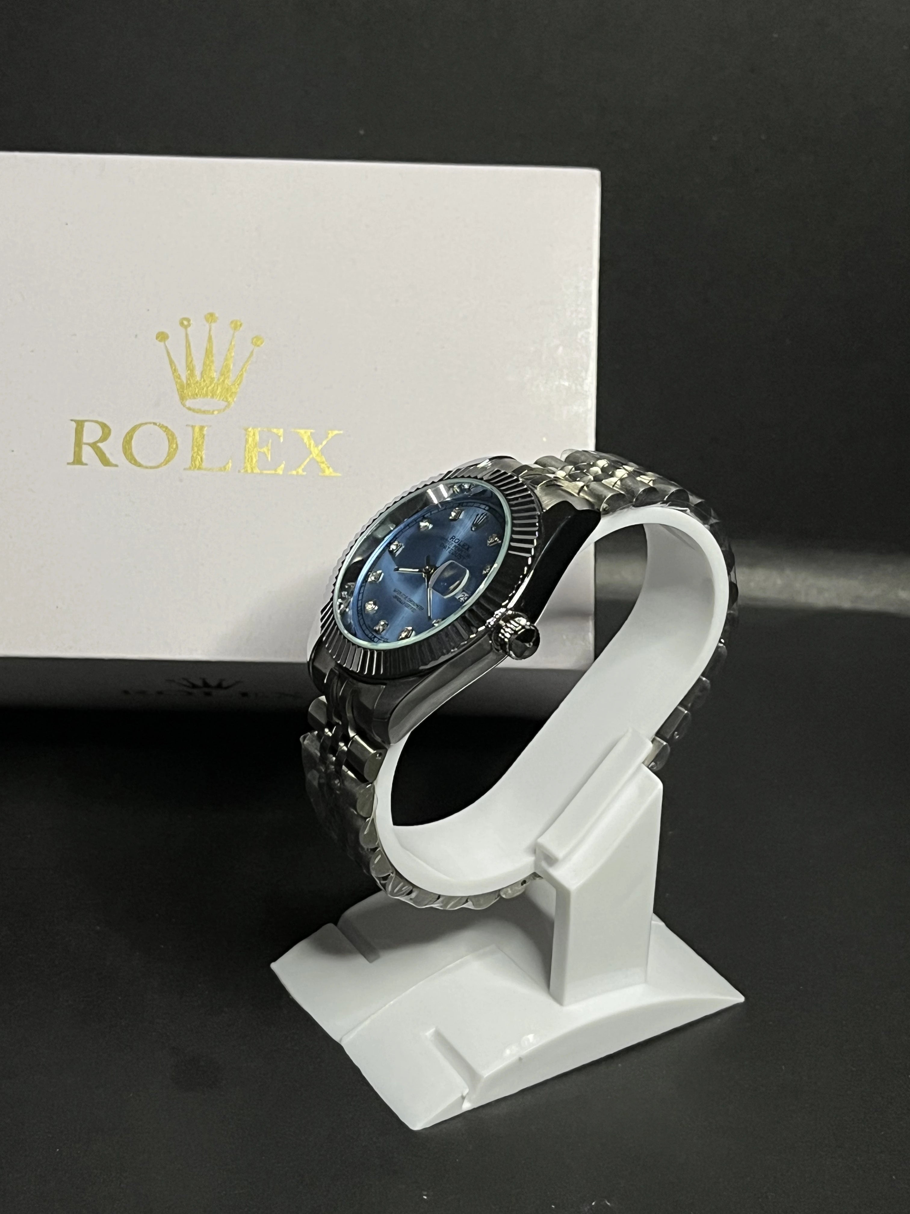 Rolex Oyster Perpetual Datejust featuring an elegant ice-blue dial adorned with diamond hour markers.
