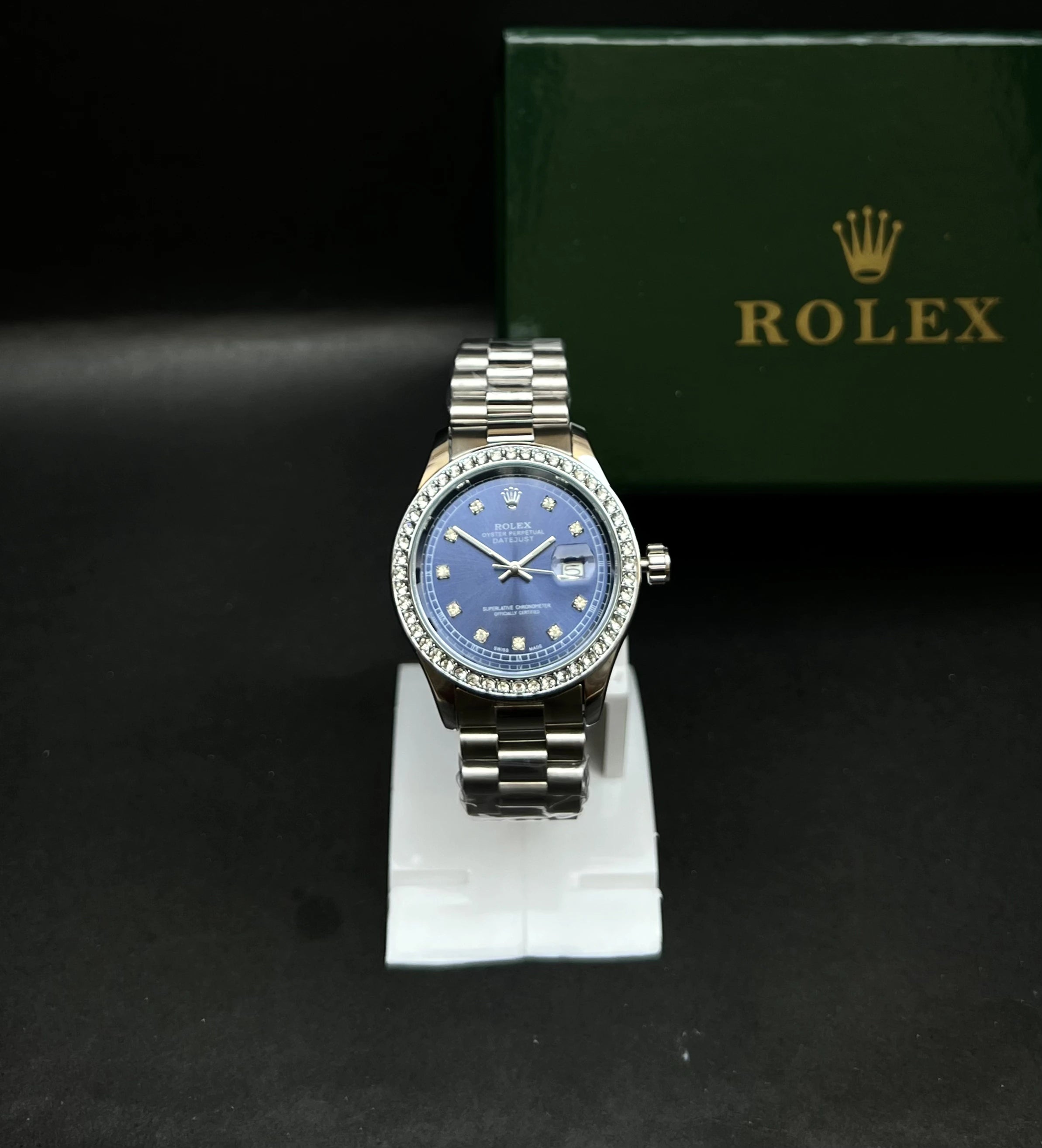 Rolex Oyster Perpetual Datejust with a stunning sunburst blue dial accented by diamond hour markers