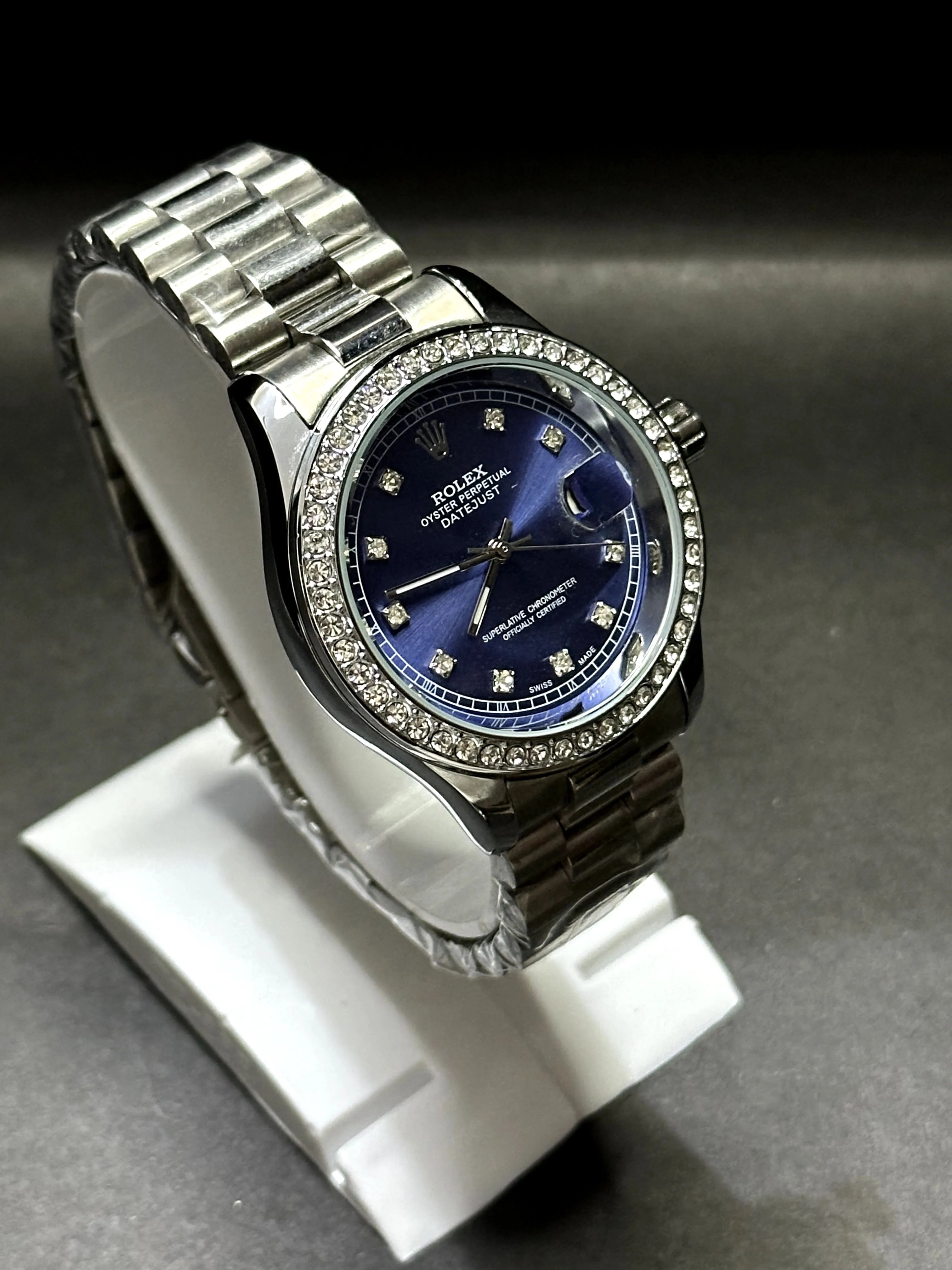 Rolex Oyster Perpetual Datejust with a stunning sunburst blue dial accented by diamond hour markers