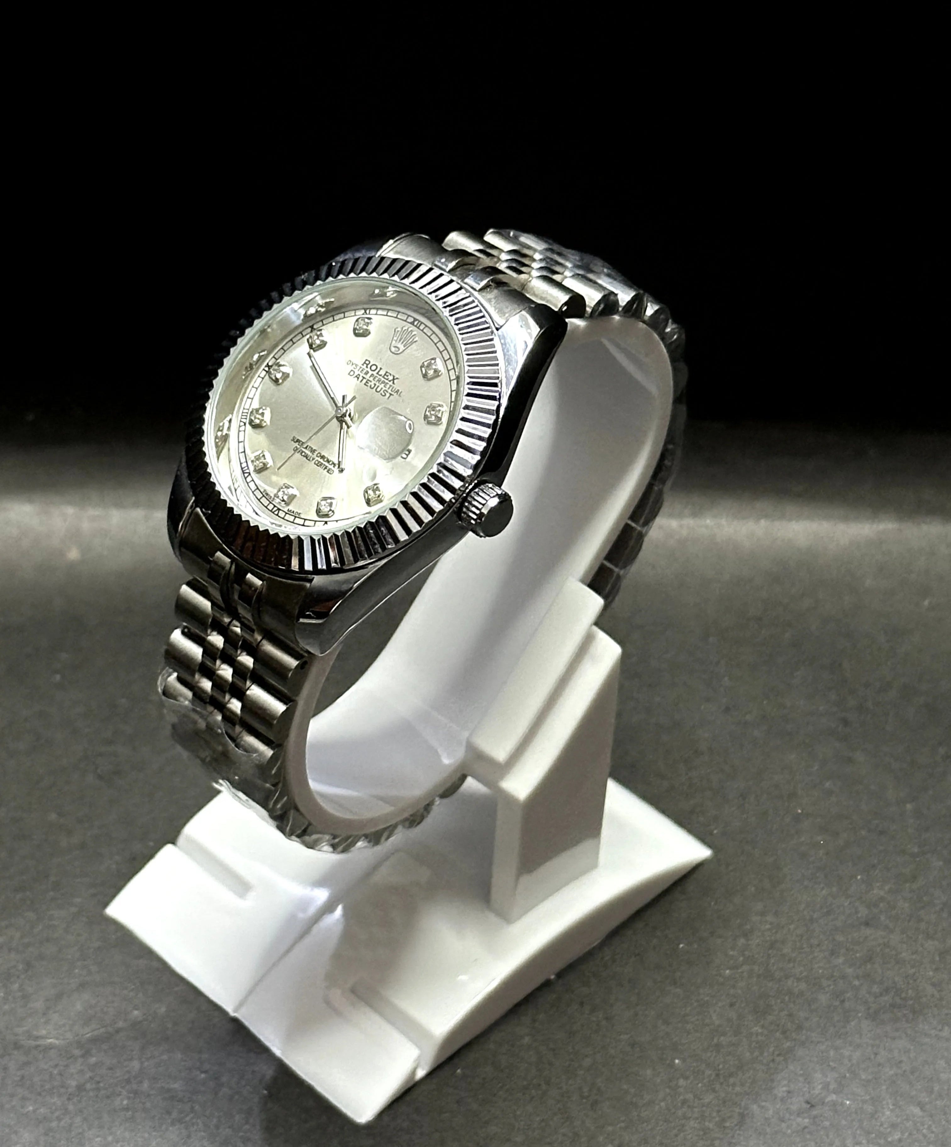 Rolex Datejust, Silver dial with diamond-set hour markers,a model with a silver dial, fluted bezel, and jubilee bracelet.